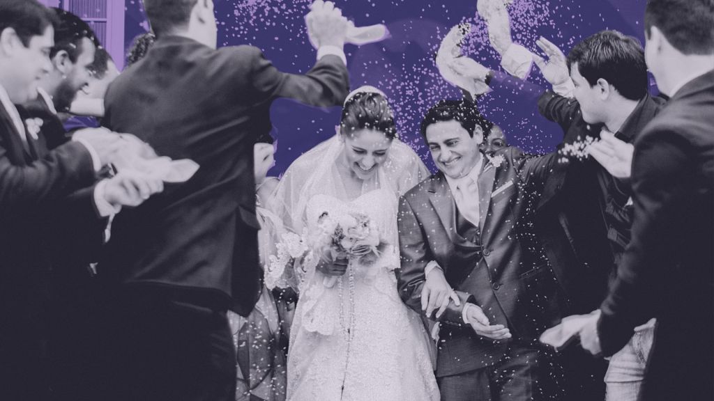 Couple walking out of a wedding.